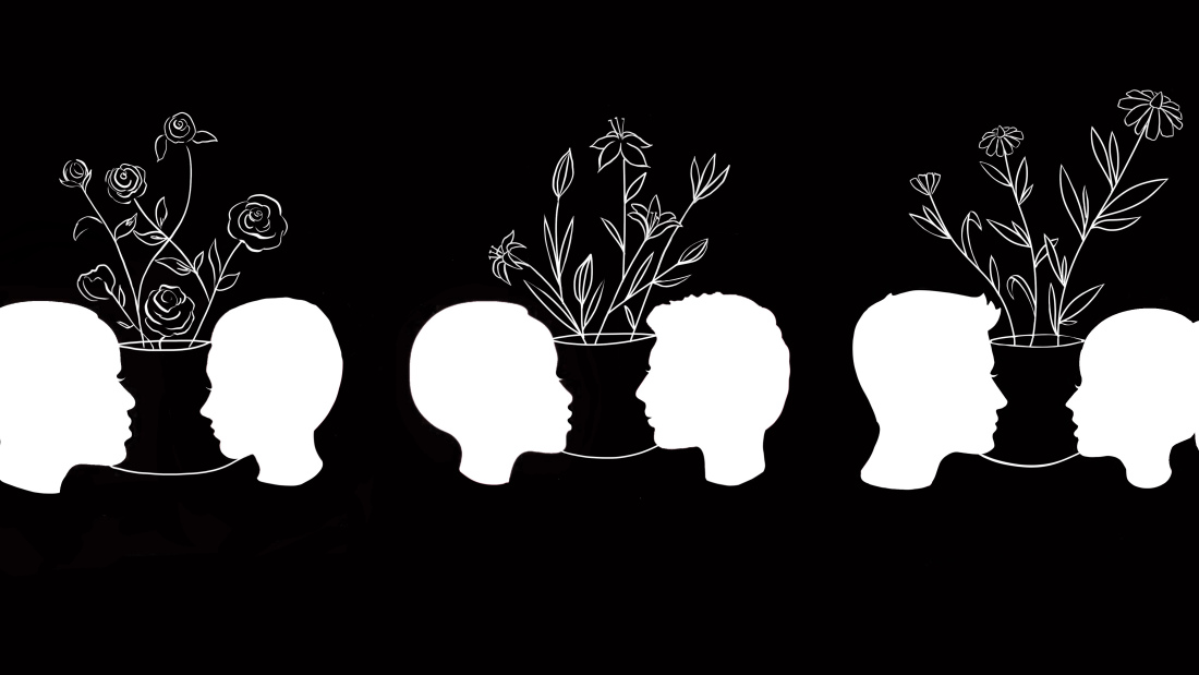 silhouettes of faces, with abstract flowering plants drawn between them, against black background 