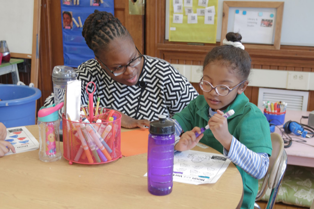 Mona Ford Walker with a student at Winship Elementary