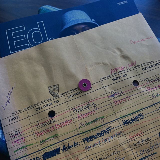 Ed. magazine peeking out of paper bag