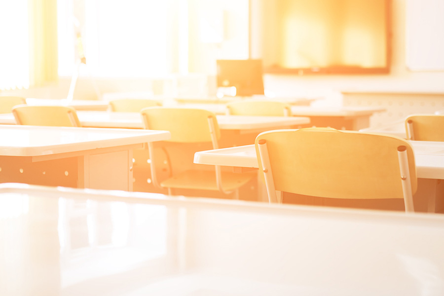 Empty classroom with sun shining in