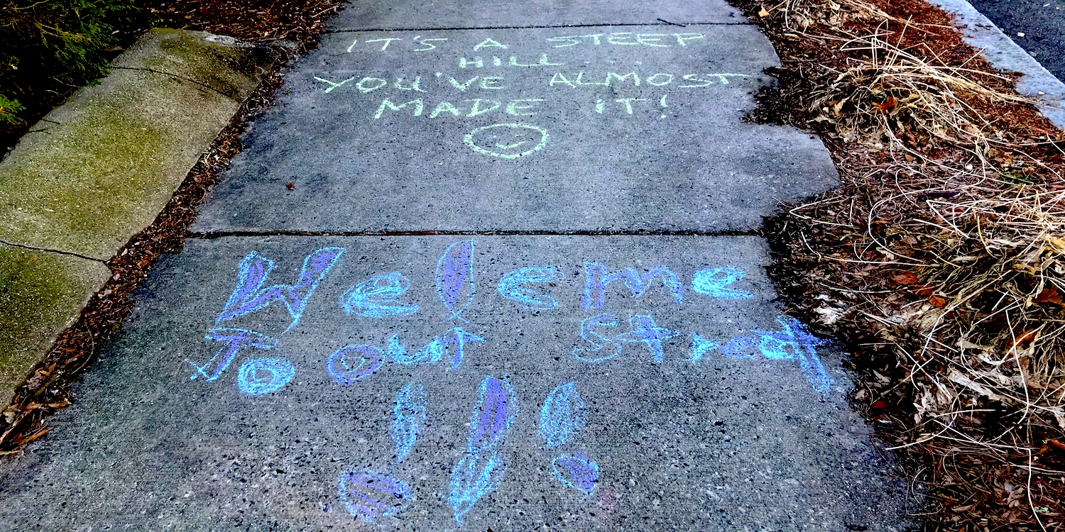 sidewalk chalk message saying 
