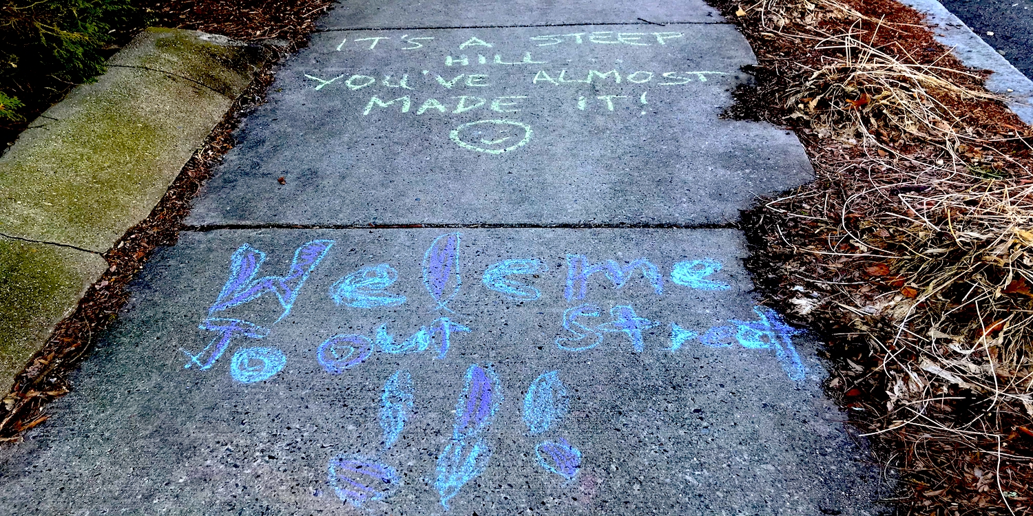 sidewalk chalk message saying