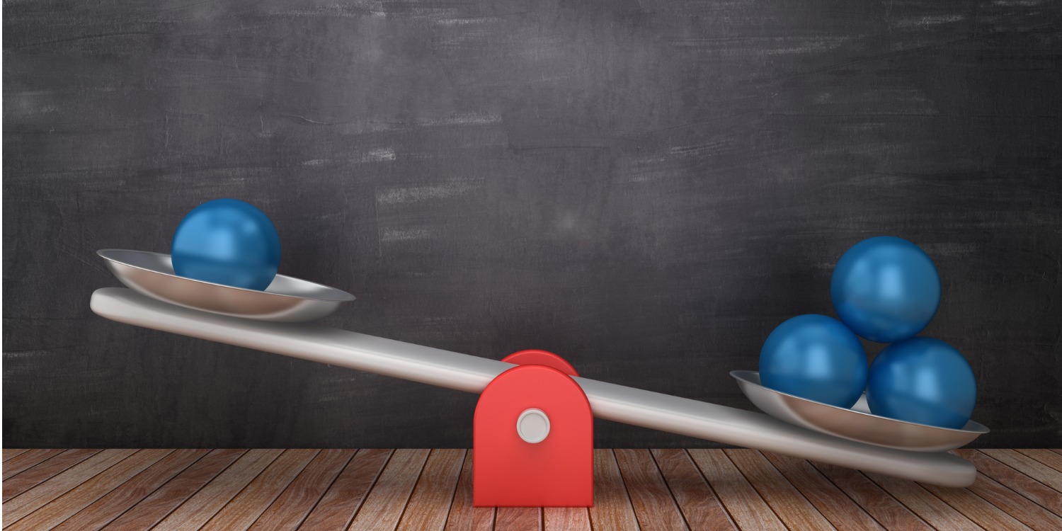 seesaw scale with uneven weights, suggesting unfair advantage