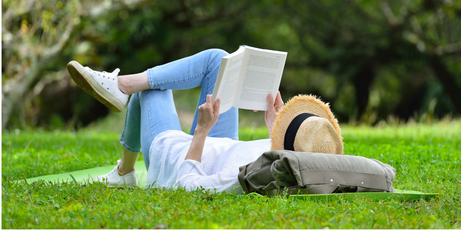 Woman reading on grass