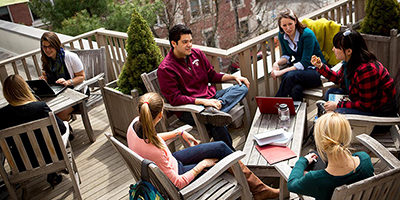 Students working together on outdoor terrace