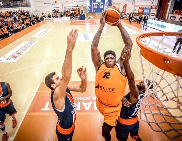 Kazembe Abif jumps to shoot a basketball