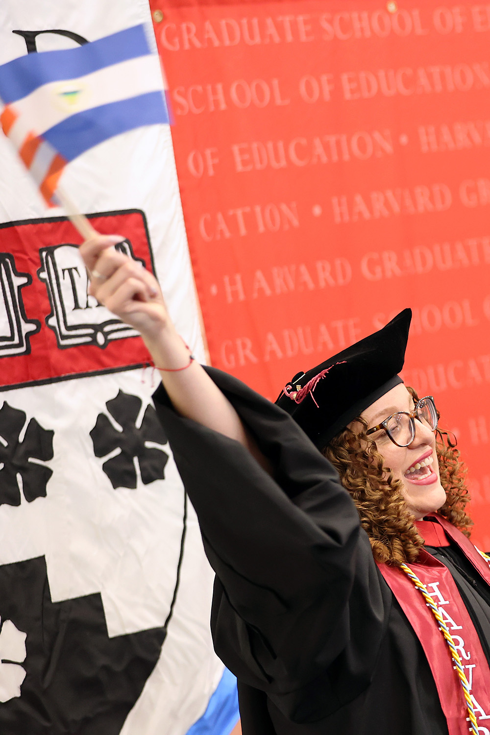 Graduate waves a flag