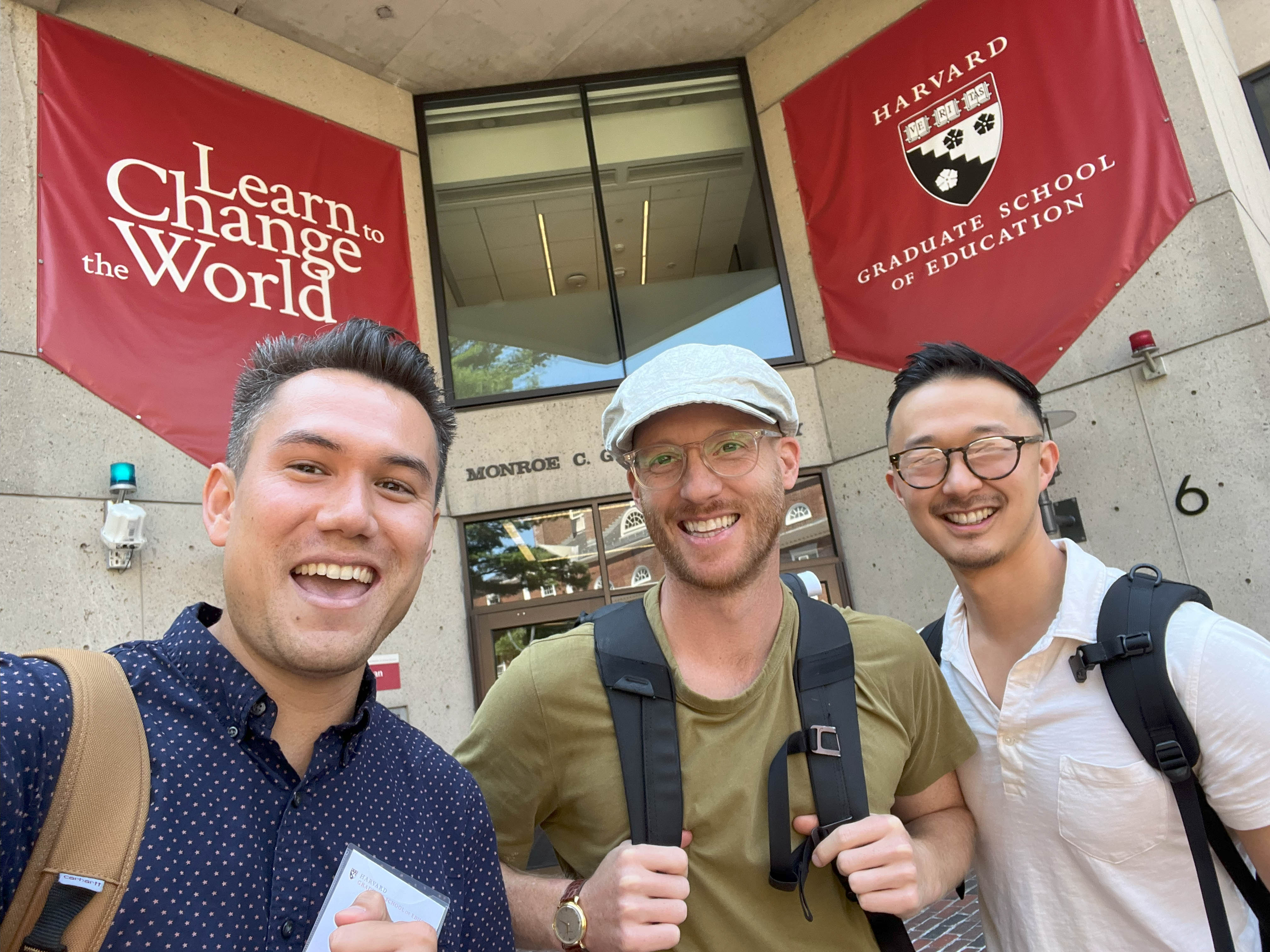 A photo of Scott Bower with friends outside of Gutman Library