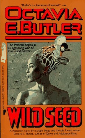 book cover of "wildseed" featuring an orange background and woman with head decoration in the shape of a bird