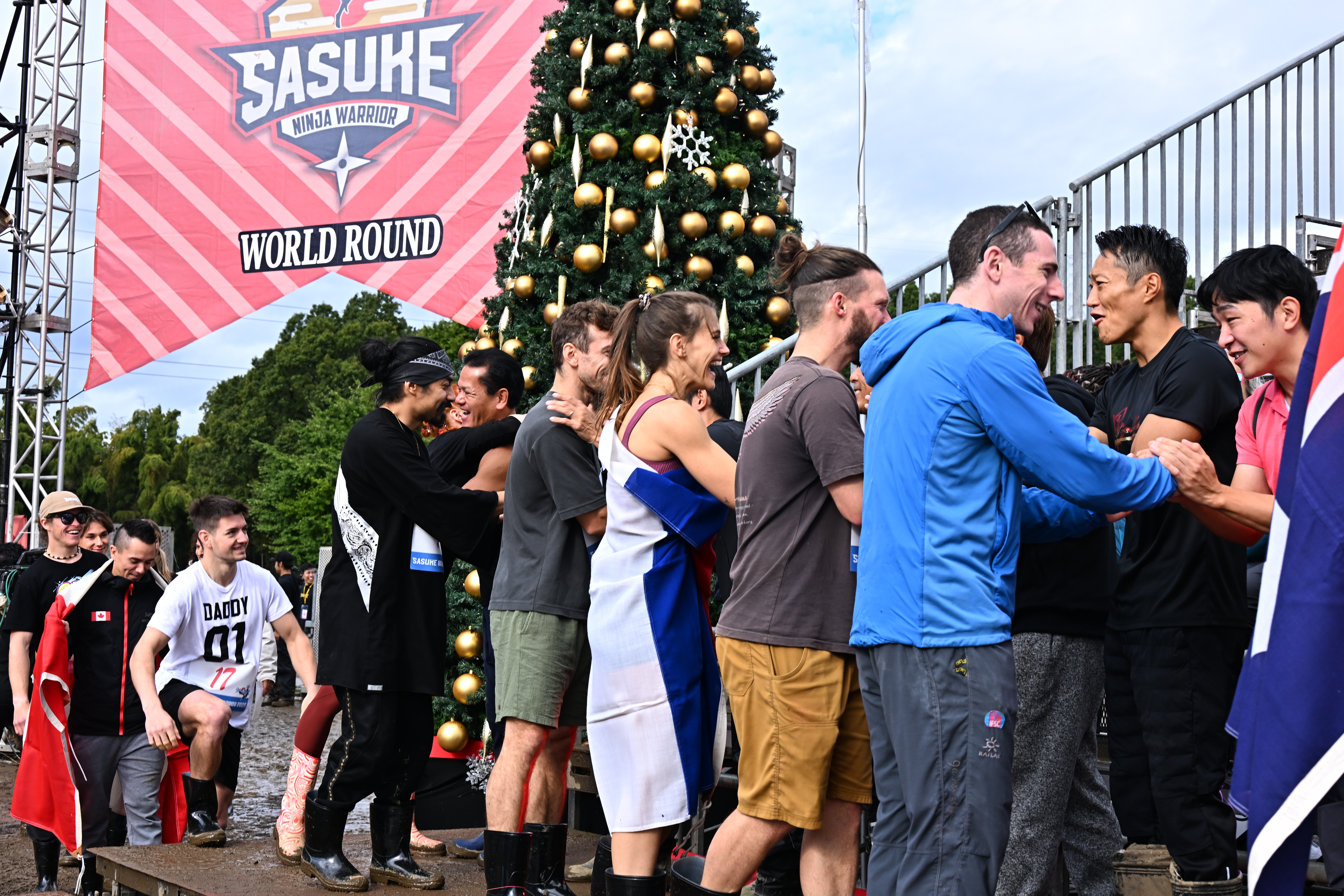 Josh Levin shakes hands with fellow competitors on Sasuke Ninja Warrior