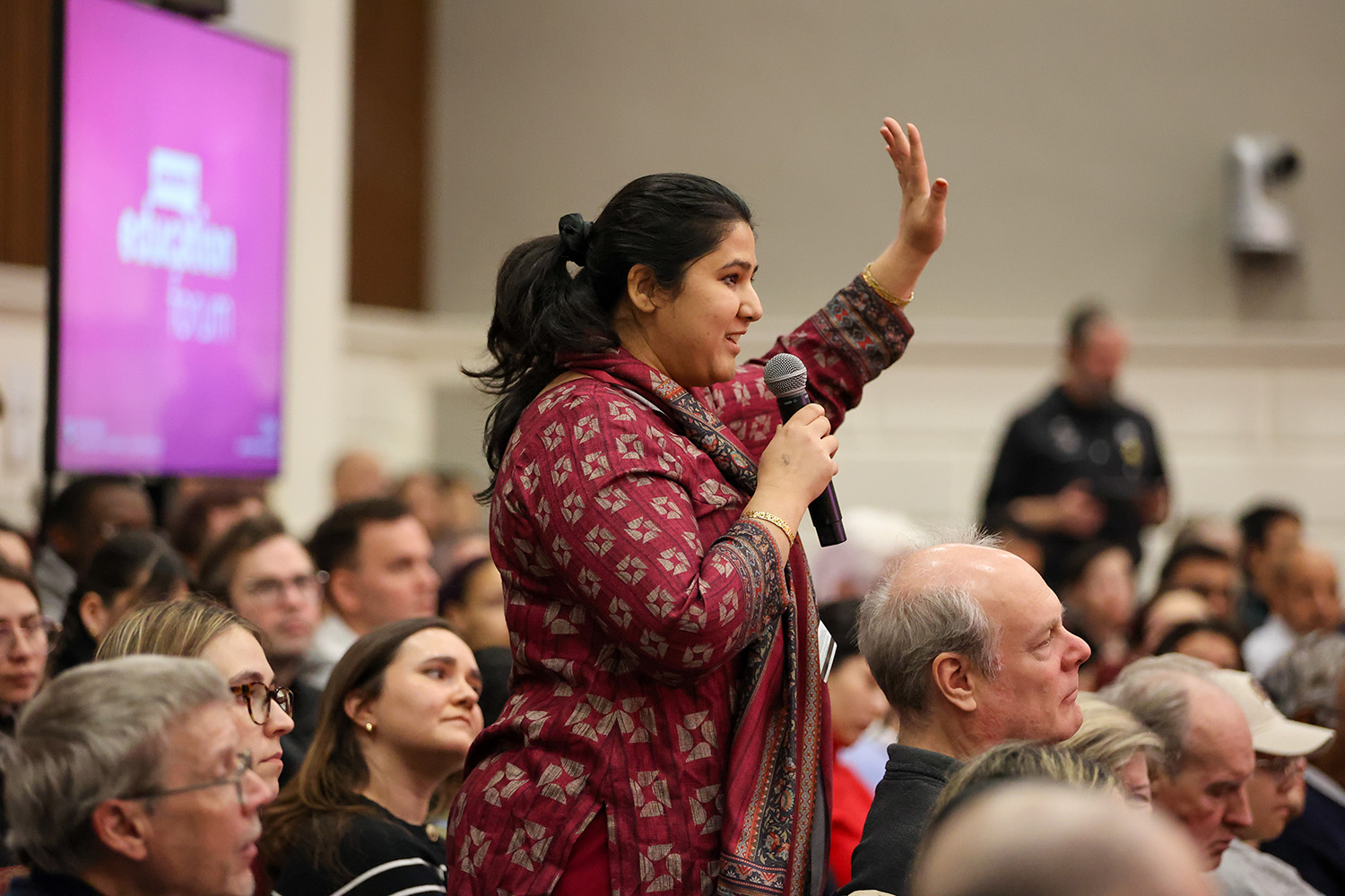 An attendee responds to Michael Sandel's questions during the Askwith Education Forum.