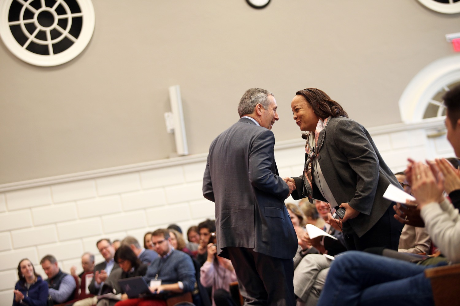 Dean Bridget Terry Long greets Harvard President Lawrence Bacow