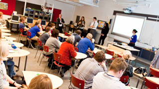 The team presented the U.S. education system to an audience of teachers at Lumo High School in Vantaa (left to right: Conklin, Lynch, Tan, Viola, and Shih).
