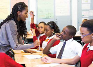 Teacher with student at Promise Academy Class