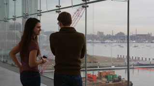 Students in Senior Lecturer Joe Blatt's "Informal Learning for Children" course discuss the class assignment in the Founders' Gallery at the Institute of Contemporary Art.