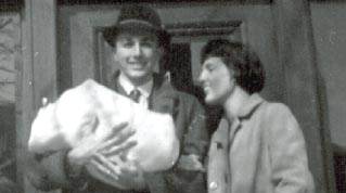 Photo of Dick and Meg with their son in 1962