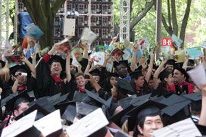 Grads hold books