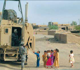 Children and soldiers by a tank