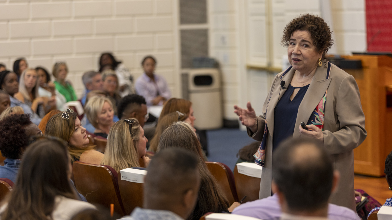 Mary Grassa O'Neil speaks to participants in Askwith Hall