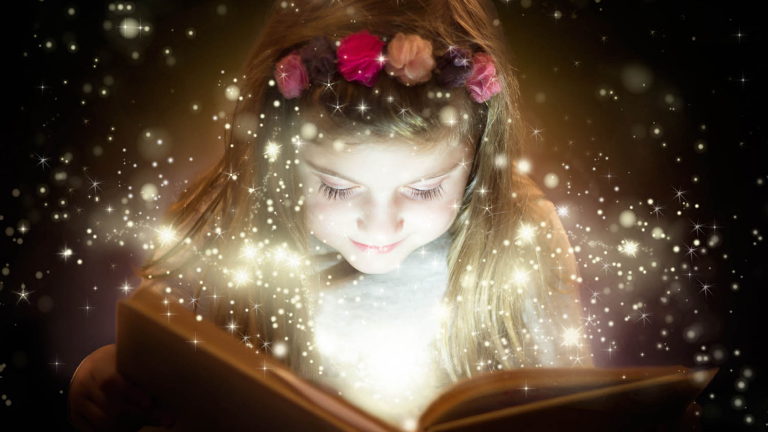 Girl reading book with sparkle concept