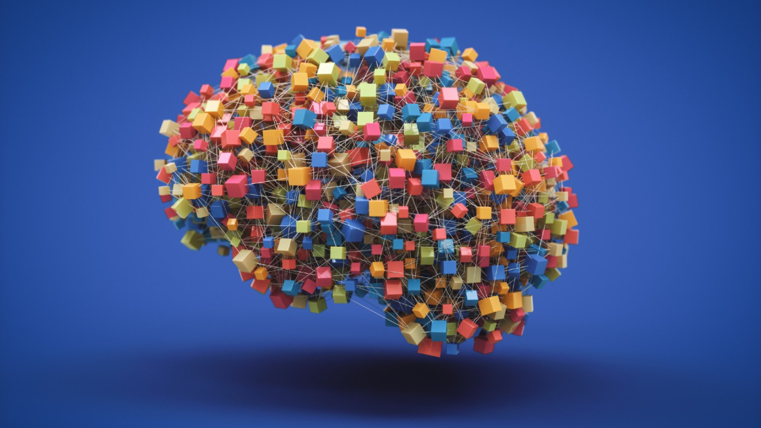 A human brain made of colorful, tiny boxes.