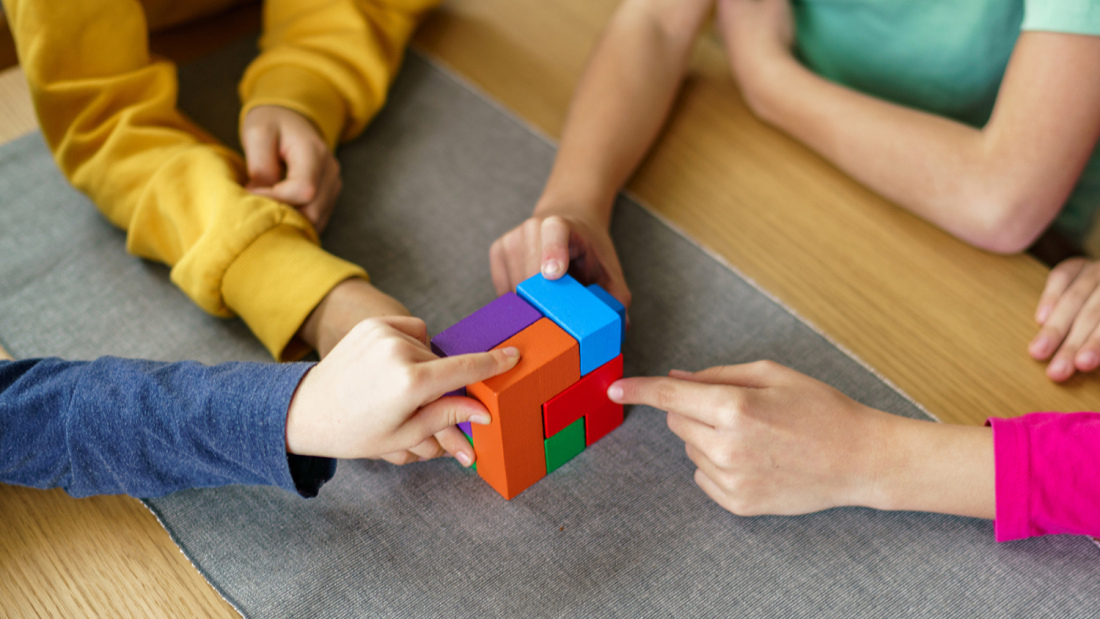 Children playing with blocks on a table