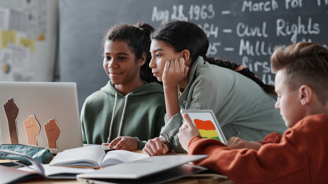 Photograph of three students working together 