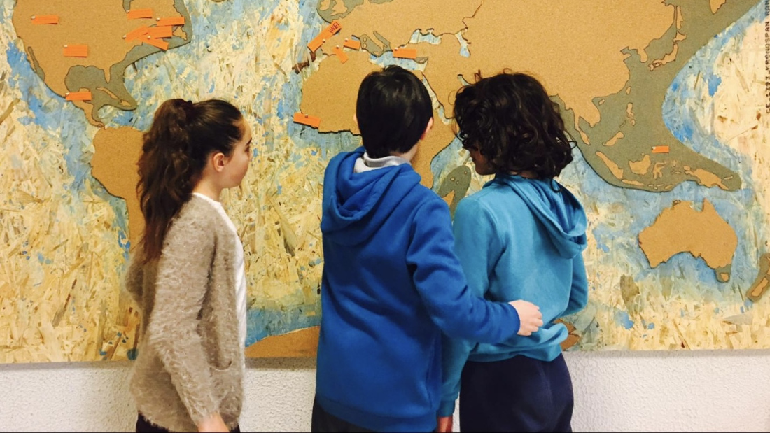 Students looking at a map