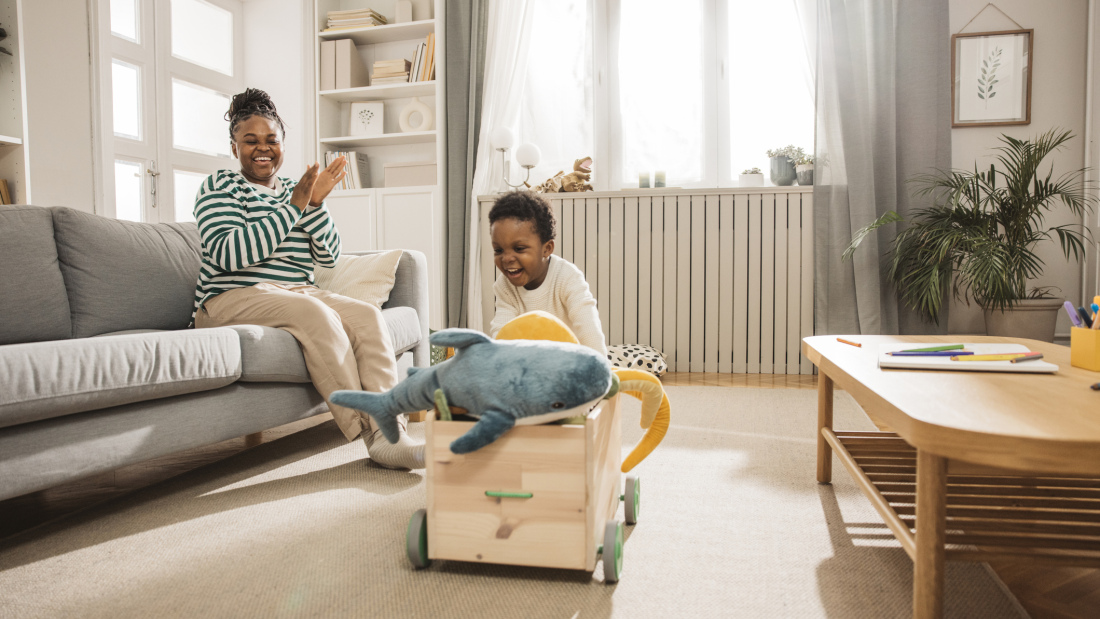 toddler picking up toys