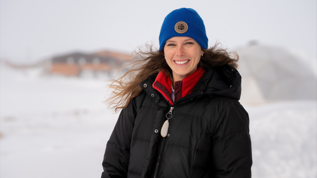 Michelle-Anne_Engelstad stands outside in the Arctic, surrounded by snow