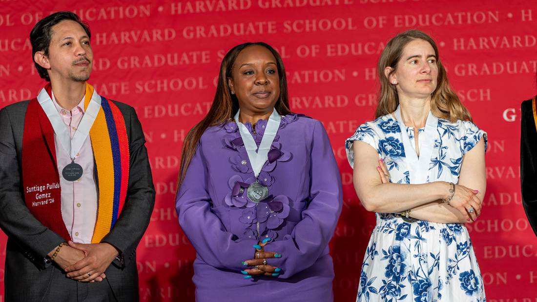Photo of three doctoral marshals with medals