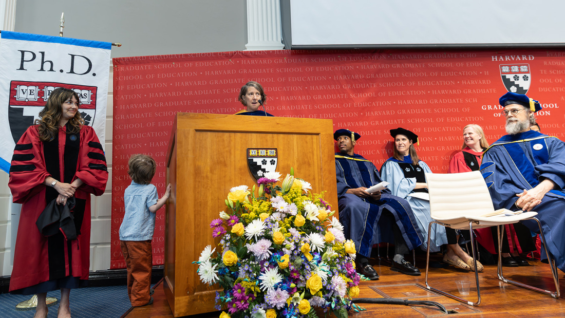Heather Hill presents robe to graduate