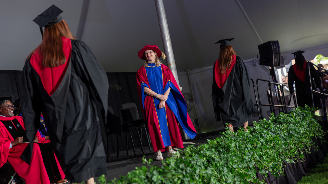 Master's student crosses the stage at the 2026 Diploma Ceremony
