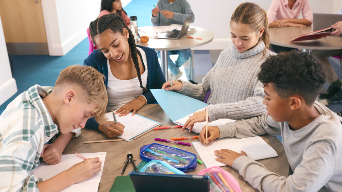 High school students drawing and writing together
