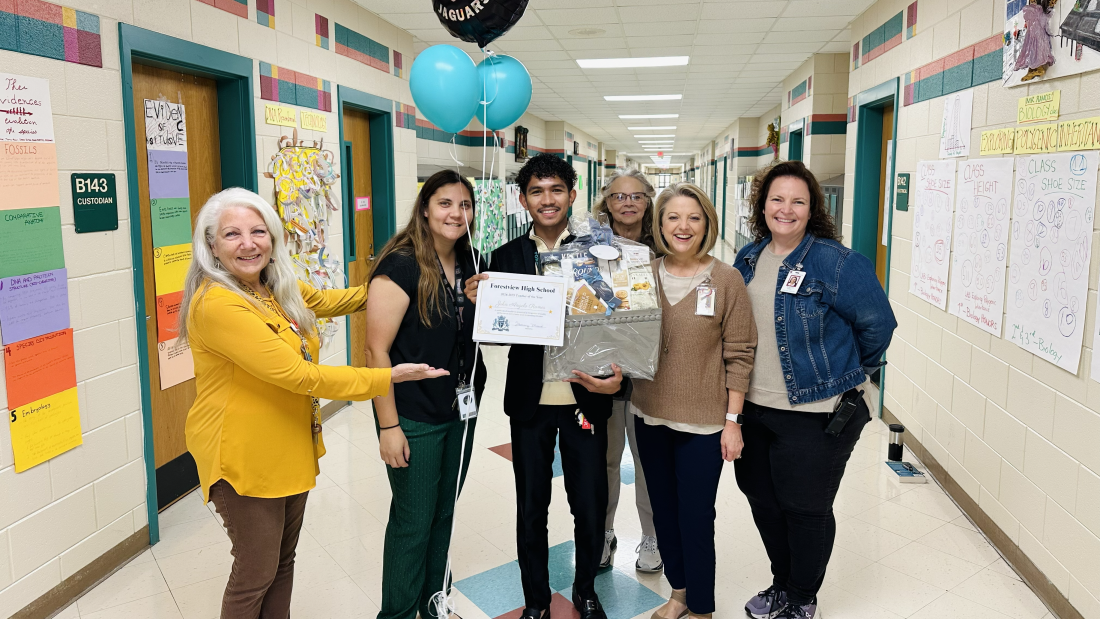 John Ramos celebrating his Teacher of the Year award with colleagues