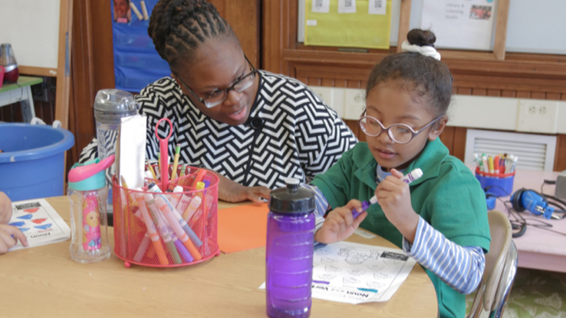 Mona Ford Walker with a student at Winship Elementary