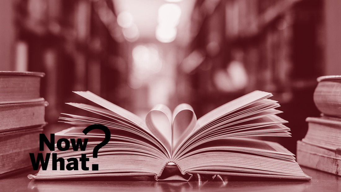 An open book with heart in pages