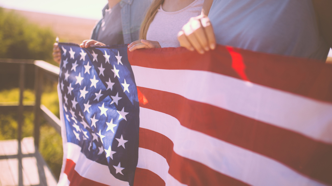 teens holding an American flag