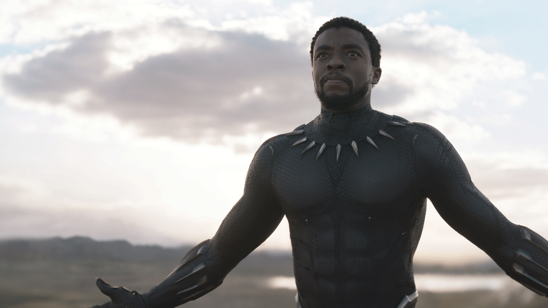 Black Panther character with mask off, against open sky