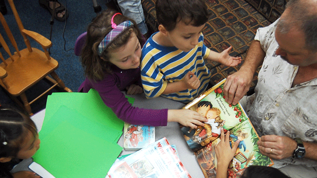 children and teacher reading children and teacher reading