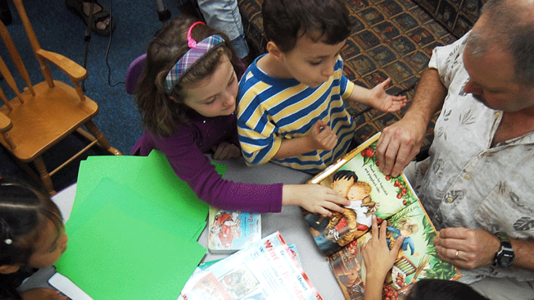 children and teacher reading