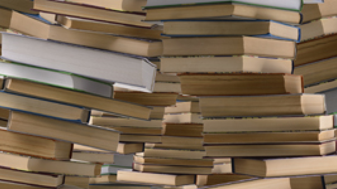 a photo of books piled up