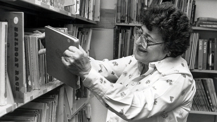 Jeanne Chall in the library stacks