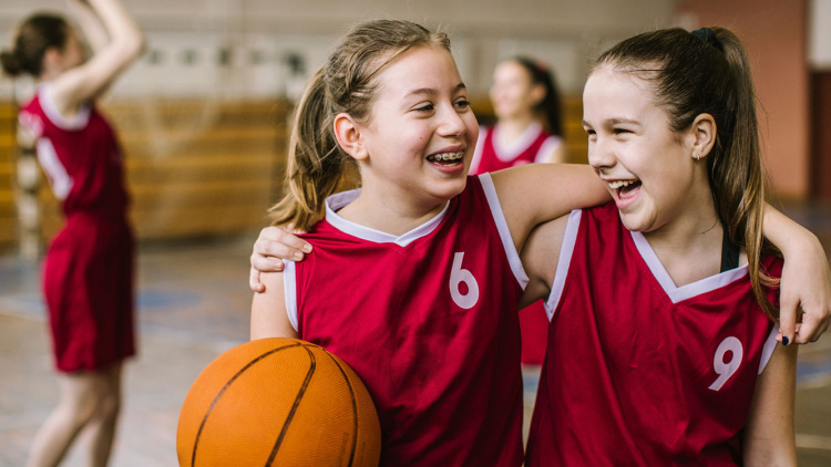 Girls happy after playing basketball