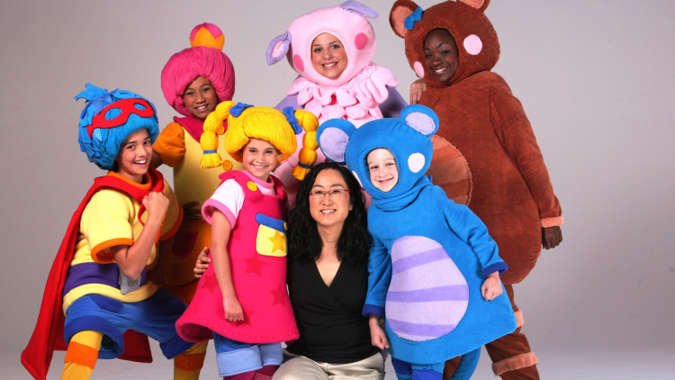 Sona Jho with characters from Mother Goose Club