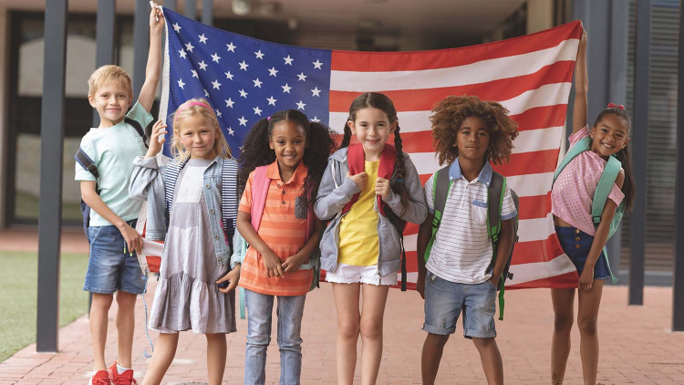 in creativity education Schoolchildren holding U.S. flag