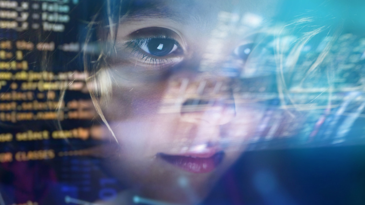 Child staring at a computer