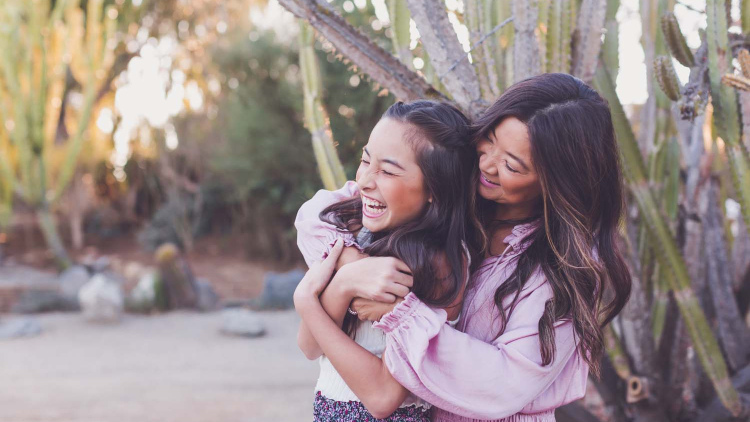 Happy mother and daughter hugging