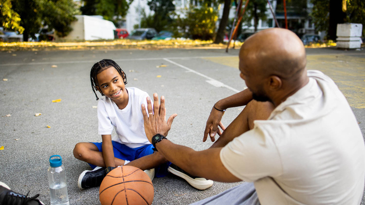 Young teen with basketball coach