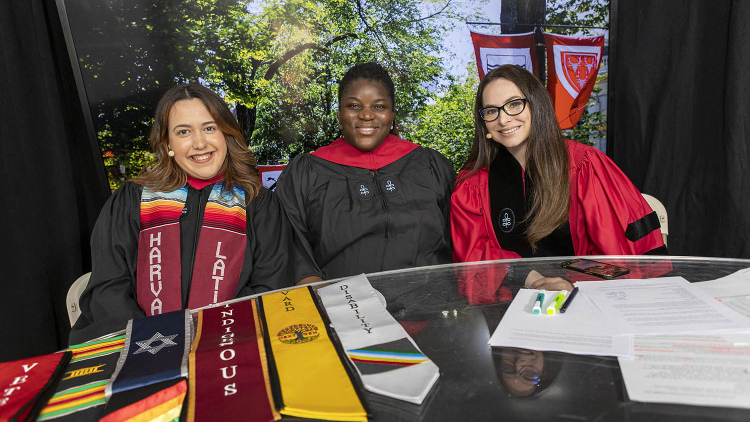 Lecturer Alexis Redding (right) is joined by HGSE alums Anabella Morabito, Ed.M.’22, and Alysha Johnson Williams, Ed.M.’20, to broadcast the Harvard Commencement pre-show